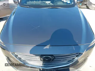 2020 Mazda CX-9 Grand Touring with VIN JM3TCADY1L0417651, listed as a IAAI auction lot 42334867 with 105,236 mi miles and . Bid and sale history available at DreamBid. Image 6.