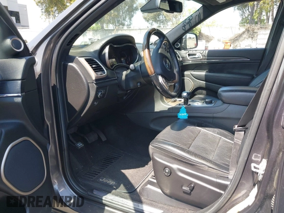 2014 Jeep Grand Cherokee Summit with VIN 1C4RJFJG8EC434899, listed as a IAAI auction lot 42399912 with 186,840 mi miles and . Bid and sale history available at DreamBid. Image 18.