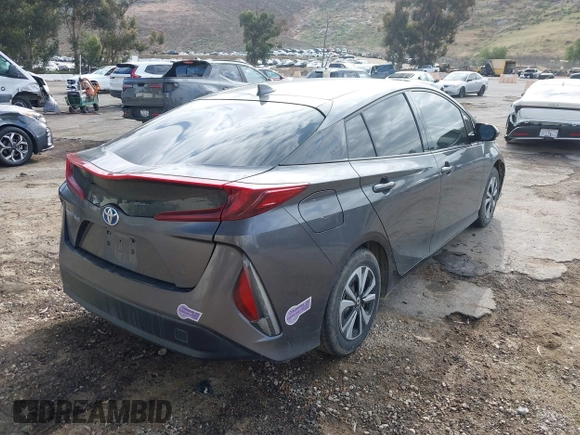 2018 Toyota Prius Plus with VIN JTDKARFPXJ3104302, listed as a IAAI auction lot 42127312 with 87,531 mi miles and . Bid and sale history available at DreamBid. Image 4.