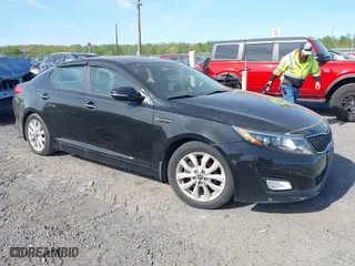 2015 Kia Optima LX with VIN KNAGM4A71F5630673, listed as a IAAI auction lot 42106584 with 245,005 mi miles. Bid and sale history available at carsss.com. Image 1.