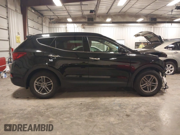2017 Hyundai Santa Fe 2.4L with VIN 5NMZUDLBXHH041621, listed as a IAAI auction lot 42194586 with 91,012 mi miles and . Bid and sale history available at DreamBid. Image 14.