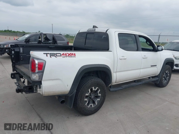2022 Toyota Tacoma SR z VIN 3TMCZ5AN7NM493268, wystawiony jako IAAI lot #42041593 z przebiegiem 100 589 mil mil oraz . Historia ofert i sprzedaży dostępna na DreamBid. Obrazek 4.