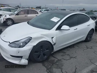 2021 Tesla Model 3 Long Range with VIN 5YJ3E1EB6MF878957, listed as a IAAI auction lot 41915482 with 59,578 mi miles. Bid and sale history available at carsss.com. Image 2.