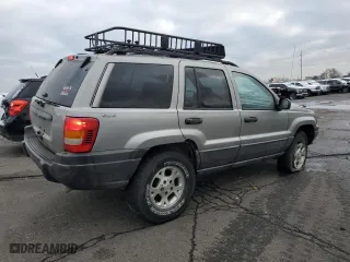 2001 Jeep Grand Cherokee Laredo with VIN 1J4GW48SX1C607432, listed as a Copart auction lot 51649365 with 296,308 mi miles and Salvage Title. Bid and sale history available at carsss.com. Image 3.