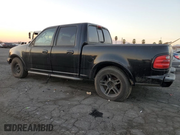 2002 Ford F-150 Harley Davidson with VIN 1FTRW07332KE10689, listed as a Copart auction lot 88341885 with 0 mi miles and Salvage Title. Bid and sale history available at carsss.com. Image 2.