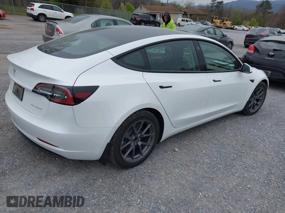 2021 Tesla Model 3 Long Range with VIN 5YJ3E1EBXMF980102, listed as a IAAI auction lot 41944364 with 48,766 mi miles and . Bid and sale history available at carsss.com. Image 4.
