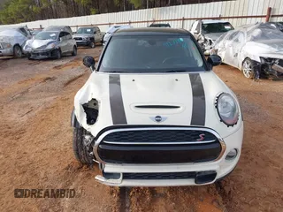 2015 MINI Hardtop 4 Door S z VIN WMWXU3C50F2B59450, wystawiony jako IAAI lot #41271841 z przebiegiem 70 719 mil mil oraz . Historia ofert i sprzedaży dostępna na DreamBid. Obrazek 13.