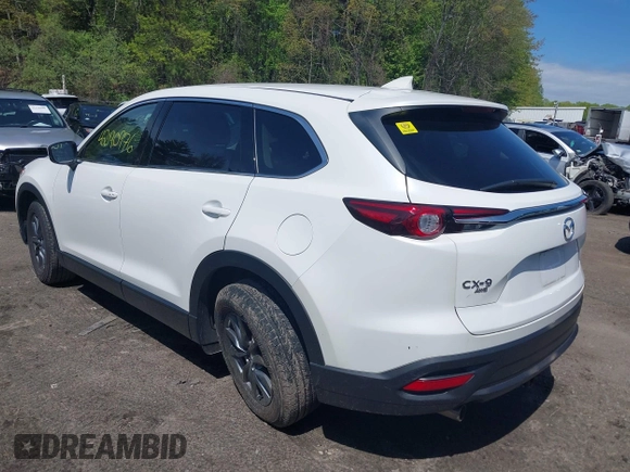 2021 Mazda CX-9 Touring z VIN JM3TCBCYXM0521323, wystawiony jako IAAI lot #42190976 z przebiegiem 56 652 mil mil oraz . Historia ofert i sprzedaży dostępna na DreamBid. Obrazek 3.