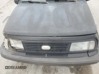 1994 Geo Tracker z VIN 2CNBE18U9R6936156, wystawiony jako Copart lot #45881915 z przebiegiem 201 227 mil mil oraz Szkody całkowita. Historia ofert i sprzedaży dostępna na DreamBid. Obrazek 11.