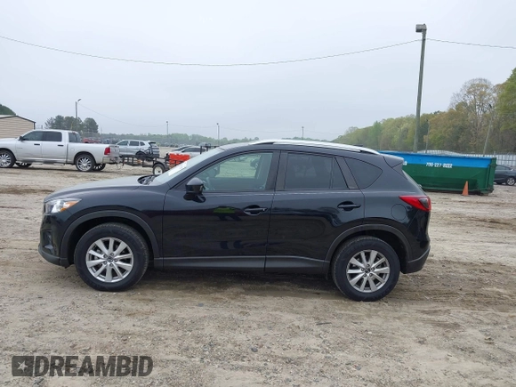 2014 Mazda CX-5 Touring with VIN JM3KE2CY7E0341658, listed as a IAAI auction lot 41915807 with 99,287 mi miles. Bid and sale history available at carsss.com. Image 15.