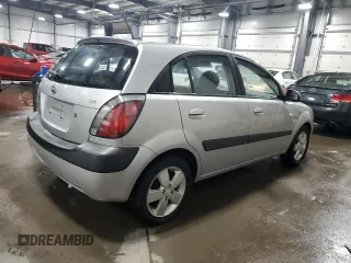 2009 Kia Rio LX with VIN KNADE243196496923, listed as a Copart auction lot 44235725 with 103,171 mi miles and Salvage Title. Bid and sale history available at carsss.com. Image 3.