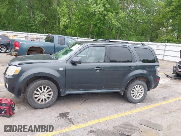 2009 Mercury Mariner Premier z VIN 4M2CU87759KJ17765, wystawiony jako IAAI lot #42354423 z przebiegiem 163 907 mil mil oraz . Historia ofert i sprzedaży dostępna na DreamBid. Obrazek 14.