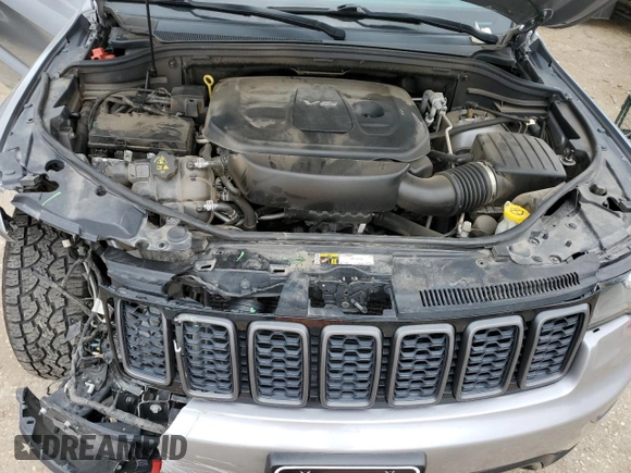 2018 Jeep Grand Cherokee Trailhawk with VIN 1C4RJFLG8JC164774, listed as a Copart auction lot 51699845 with 104,467 mi miles and Salvage title. Bid and sale history available at DreamBid. Image 12.