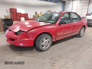 1999 Pontiac Sunfire SE z VIN 1G2JB524XX7547651, wystawiony jako IAAI lot #41962158 z przebiegiem 130 385 mil mil oraz . Historia ofert i sprzedaży dostępna na DreamBid. Obrazek 2.