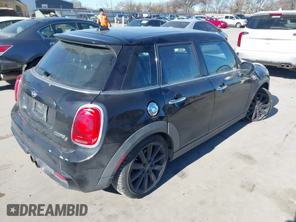 2015 MINI Hardtop 4 Door S with VIN WMWXU3C53F2B56459, listed as a IAAI auction lot 41400624 with 233,850 mi miles and . Bid and sale history available at DreamBid. Image 4.