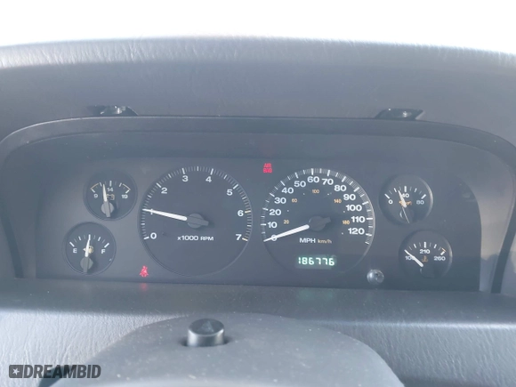 1999 Jeep Grand Cherokee Laredo with VIN 1J4GW58S5XC687480, listed as a IAAI auction lot 42016415 with 186,776 mi miles. Bid and sale history available at carsss.com. Image 7.