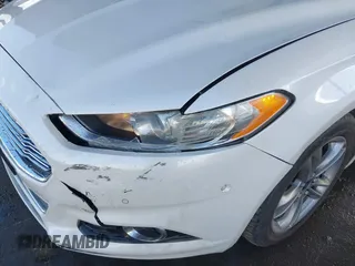 2016 Ford Fusion Titanium Hybrid with VIN 3FA6P0RU1GR191813, listed as a IAAI auction lot 41560954 with 86,922 mi miles. Bid and sale history available at carsss.com. Image 13.