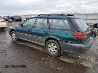 1996 Subaru Legacy Outback with VIN 4S3BG6858T7974280, listed as a Copart auction lot 78790874 with 290,480 mi miles and Salvage title. Bid and sale history available at DreamBid. Image 2.