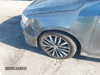 2016 Volkswagen Jetta Sport z VIN 3VWD17AJ0GM386504, wystawiony jako IAAI lot #42000125 z przebiegiem 90 405 mil mil oraz . Historia ofert i sprzedaży dostępna na DreamBid. Obrazek 6.