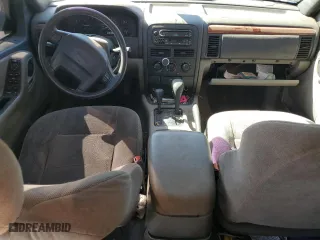 1999 Jeep Grand Cherokee Laredo with VIN 1J4GW58SXXC786179, listed as a Copart auction lot 79774564 with 272,192 mi miles and Salvage Title. Bid and sale history available at carsss.com. Image 8.