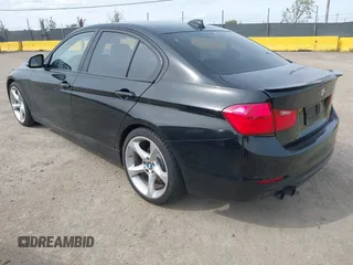 2012 BMW 3 Series 328i with VIN WBA3A5C56CF345904, listed as a IAAI auction lot 41992572 with 136,672 mi miles. Bid and sale history available at carsss.com. Image 3.