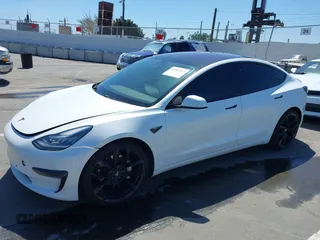 2019 Tesla Model 3 Mid Range with VIN 5YJ3E1EA5KF327181, listed as a IAAI auction lot 41860943 with 157,335 mi miles and . Bid and sale history available at DreamBid. Image 20.