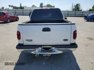 2001 Ford F-150 XLT with VIN 1FTRW07651KC49772, listed as a Copart auction lot 59904815 with 145,639 mi miles and Salvage title. Bid and sale history available at DreamBid. Image 6.