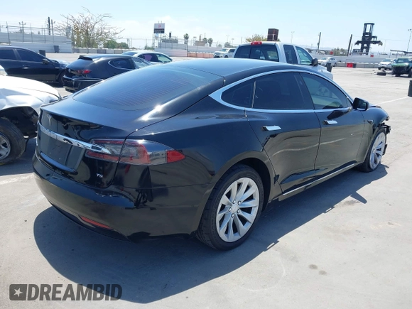 2017 Tesla Model S 60 with VIN 5YJSA1E17HF232699, listed as a IAAI auction lot 42327539 with 113,923 mi miles and . Bid and sale history available at DreamBid. Image 4.