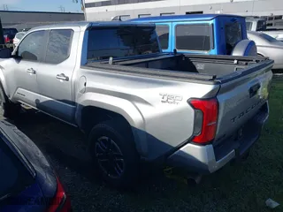 2024 Toyota Tacoma 4WD SR5 with VIN 3TMLB5JN4RM021667, listed as a IAAI auction lot 41343801 with 5,037 mi miles. Bid and sale history available at carsss.com. Image 3.