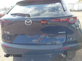2022 Mazda CX-30 S with VIN 3MVDMBALXNM402265, listed as a IAAI auction lot 41458605 with 76,291 mi miles and . Bid and sale history available at carsss.com. Image 18.