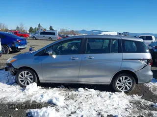2014 Mazda 5 Sport with VIN JM1CW2BLXE0168119, listed as a IAAI auction lot 41527688 with 142,357 mi miles and . Bid and sale history available at DreamBid. Image 14.