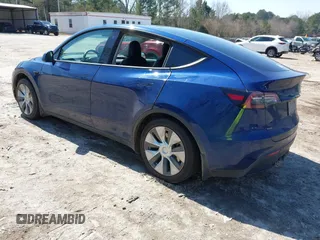 2021 Tesla Model Y Long Range with VIN 5YJYGAEE1MF207948, listed as a IAAI auction lot 41779570 with 100,859 mi miles. Bid and sale history available at carsss.com. Image 3.