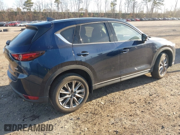 2020 Mazda CX-5 Grand Touring with VIN JM3KFBDM4L0779284, listed as a IAAI auction lot 42060936 with 9,227 mi miles. Bid and sale history available at carsss.com. Image 4.