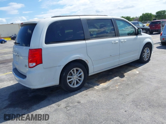 2014 Dodge Grand Caravan SXT with VIN 2C4RDGCGXER322705, listed as a IAAI auction lot 42170301 with 147,070 mi miles and . Bid and sale history available at DreamBid. Image 4.