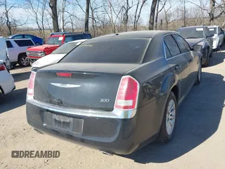 2014 Chrysler 300 with VIN 2C3CCAAG3EH252841, listed as a IAAI auction lot 41770242 with 214,000 mi miles. Bid and sale history available at carsss.com. Image 4.