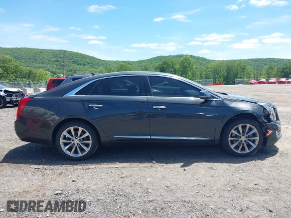 2013 Cadillac XTS Luxury z VIN 2G61R5S33D9101434, wystawiony jako IAAI lot #42290199 z przebiegiem 48 075 mil mil oraz . Historia ofert i sprzedaży dostępna na DreamBid. Obrazek 13.