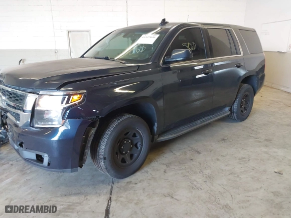 2017 Chevrolet Tahoe Commercial with VIN 1GNLCDECXHR228908, listed as a IAAI auction lot 41537030 with 114,725 mi miles. Bid and sale history available at carsss.com. Image 2.