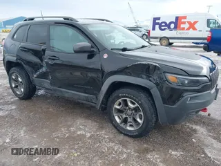 2019 Jeep Cherokee Trailhawk Elite with VIN 1C4PJMBX6KD313675, listed as a IAAI auction lot 41448924 with 51,639 mi miles. Bid and sale history available at carsss.com. Image 1.