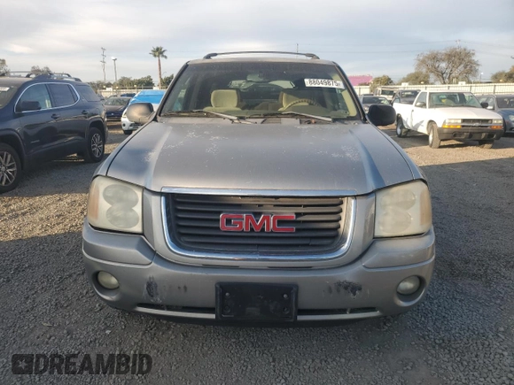 2002 GMC Envoy SLT with VIN 1GKDS13S922287249, listed as a Copart auction lot 88049875 with 157,485 mi miles and Salvage Title. Bid and sale history available at carsss.com. Image 5.