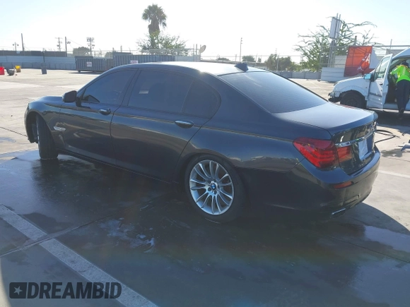 2015 BMW 7 Series 750Li with VIN WBAYE8C52FD780902, listed as a IAAI auction lot 40808265 with 102,774 mi miles. Bid and sale history available at carsss.com. Image 3.
