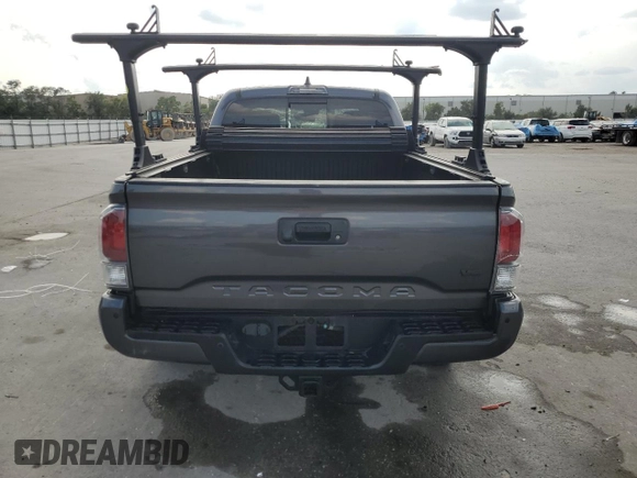 2020 Toyota Tacoma SR5 z VIN 3TYDZ5BN9LT000209, wystawiony jako Copart lot #56127875 z przebiegiem 92 350 mil mil oraz Szkoda całkowita • Salvage title. Historia ofert i sprzedaży dostępna na DreamBid. Obrazek 6.