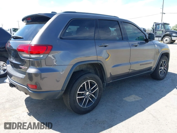 2017 Jeep Grand Cherokee Trailhawk with VIN 1C4RJFLG3HC877110, listed as a IAAI auction lot 42276506 with 144,993 mi miles and . Bid and sale history available at DreamBid. Image 4.