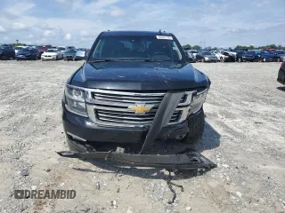 2015 Chevrolet Tahoe LTZ with VIN 1GNSCCKC2FR693500, listed as a Copart auction lot 60225195 with 206,210 mi miles and Salvage title. Bid and sale history available at DreamBid. Image 5.
