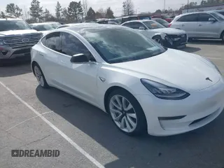 2020 Tesla Model 3 Long Range with VIN 5YJ3E1EB3LF712877, listed as a IAAI auction lot 41707832 with 31,385 mi miles. Bid and sale history available at carsss.com. Image 1.
