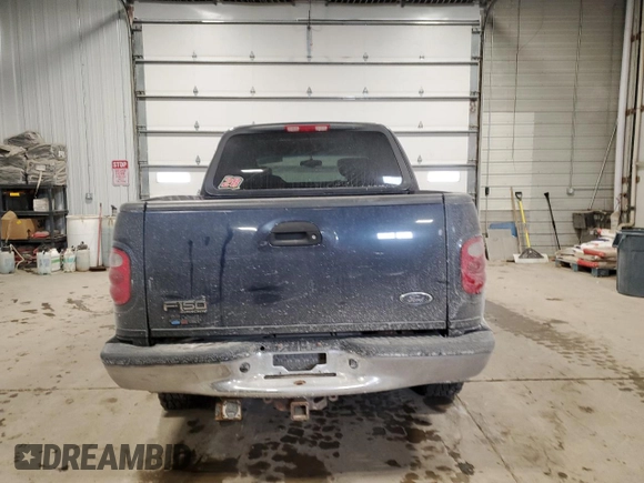 2002 Ford F-150 XLT with VIN 1FTRW08L12KE11970, listed as a Copart auction lot 45299665 with 173,802 mi miles and Salvage Title. Bid and sale history available at carsss.com. Image 6.
