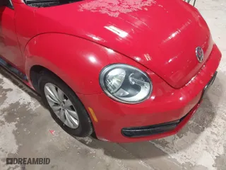2016 Volkswagen Beetle Coupe 1.8T Wolfsburg Edition with VIN 3VWF17AT2GM619843, listed as a IAAI auction lot 41829023 with 147,716 mi miles. Bid and sale history available at carsss.com. Image 6.