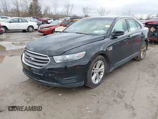 2013 Ford Taurus SEL with VIN 1FAHP2E87DG180296, listed as a IAAI auction lot 42016506 with 137,352 mi miles. Bid and sale history available at carsss.com. Image 2.