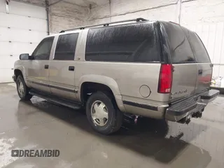1999 GMC Suburban with VIN 3GKFK16R4XG541398, listed as a IAAI auction lot 41274339 with 243,827 mi miles. Bid and sale history available at carsss.com. Image 3.