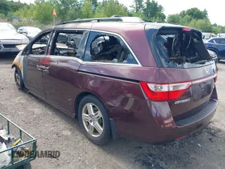 2012 Honda Odyssey Touring z VIN 5FNRL5H95CB040384, wystawiony jako IAAI lot #42751342 z przebiegiem 176 222 mil mil oraz . Historia ofert i sprzedaży dostępna na DreamBid. Obrazek 3.