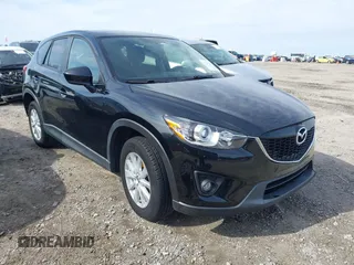 2014 Mazda CX-5 Touring with VIN JM3KE2CY9E0333951, listed as a IAAI auction lot 41825345 with 124,684 mi miles. Bid and sale history available at carsss.com. Image 1.